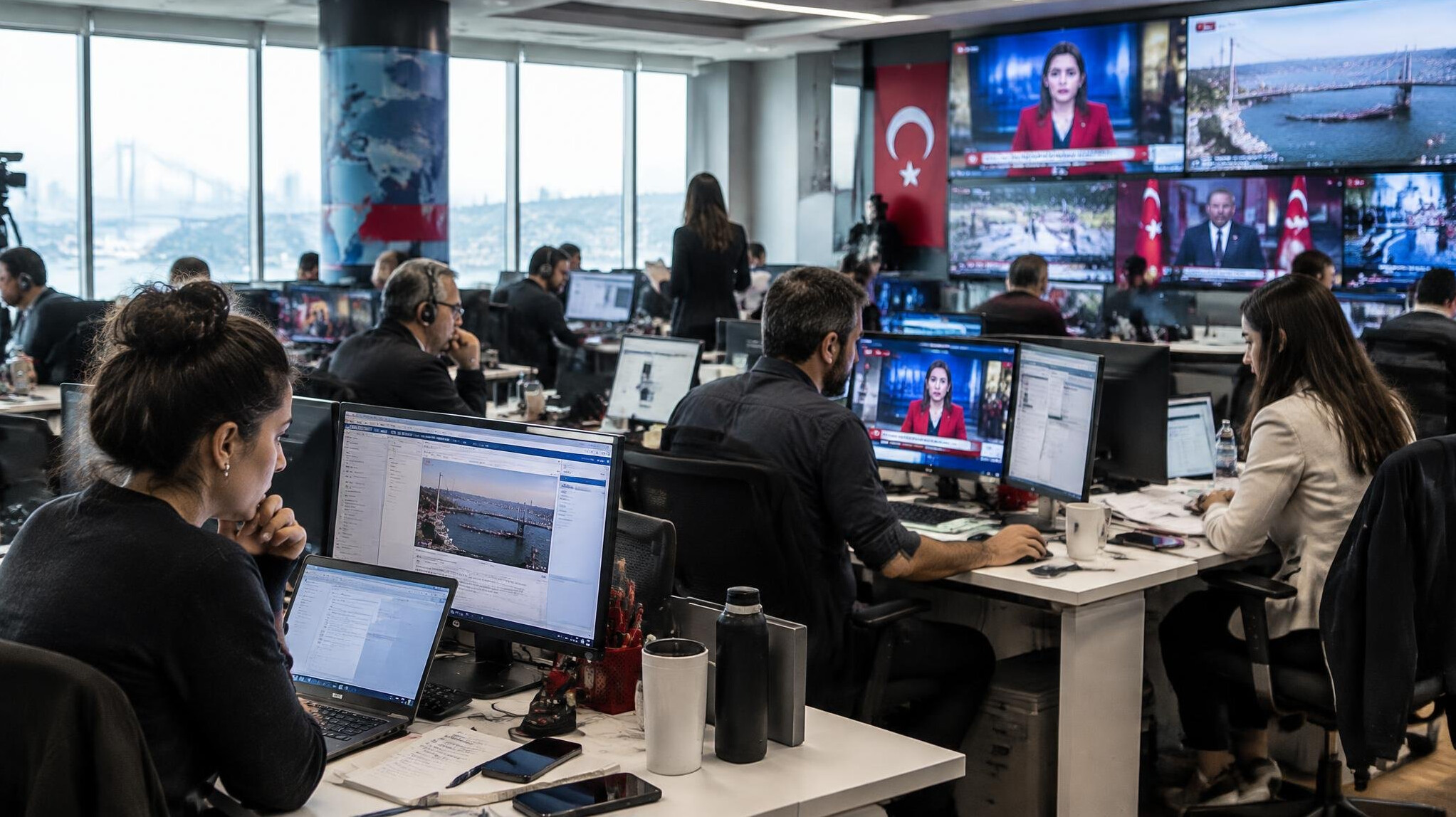 Busy newsroom with Turkish journalists working