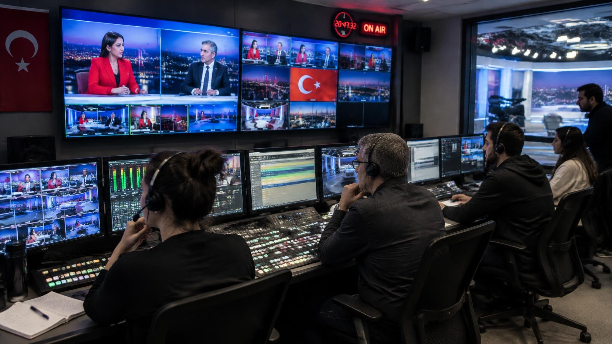 Broadcast control room with technicians during live show